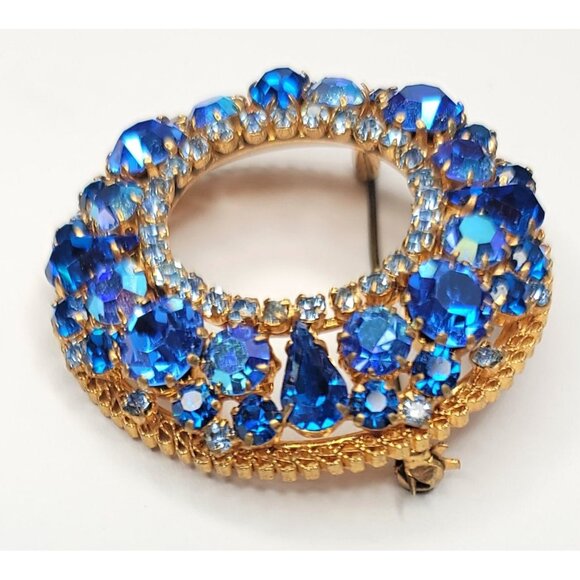 Austria Goldtone Blue Rhinestone Open Round Brooch Signed - Picture 2 of 8